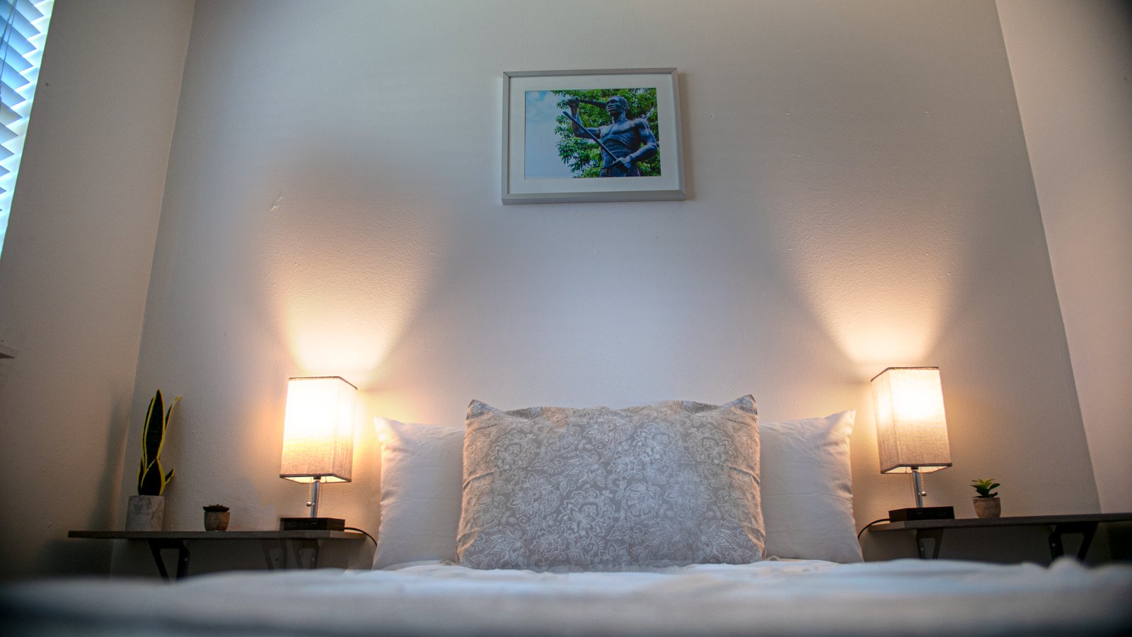A picture of Yanga hangs in this bedroom