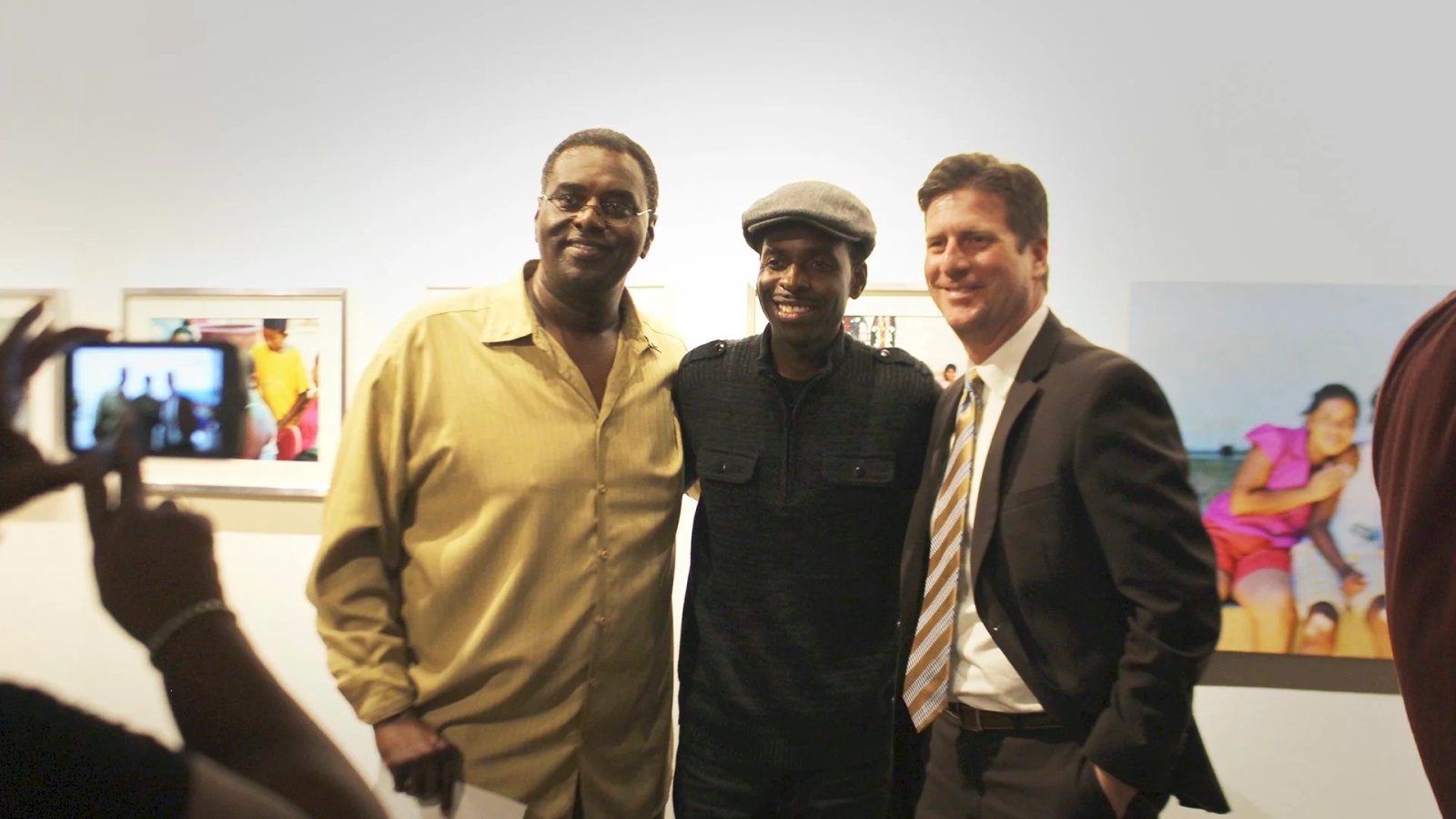 President of !00 Black Men of Phoenix, Hakeem Khaaliq, and Congressman Greg Stanton pose at Monorchid Gallery in Phoenix.