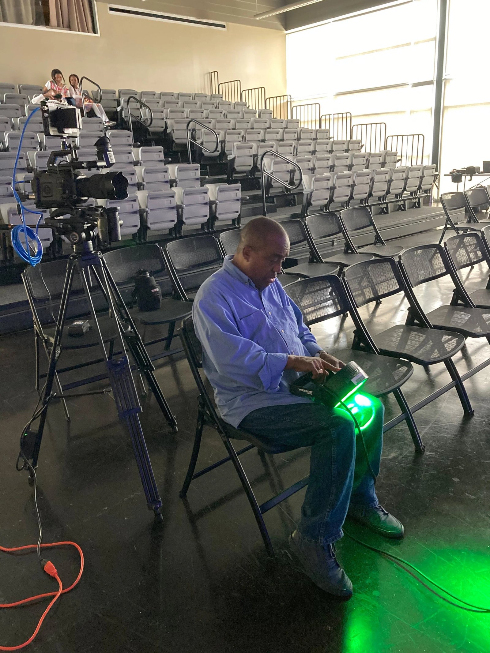 Ademah checking the lights at rehearsal.